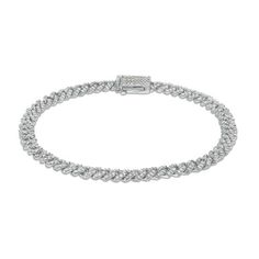 This eye-catching Cuban link style bracelet is accented with pave round brilliant cut diamonds. Elegant Diamond Cut Cuban Link Chain Bracelet, Elegant Cuban Link Chain Bracelet With Diamond Cut, Elegant Cuban Link Diamond Cut Bracelets, Fine Jewelry Diamond Link Jubilee Bracelet, Diamond Link Bracelet With Jubilee Design, Fine Jewelry Diamond Jubilee Link Bracelet, White Gold Jubilee Chain Link Bracelet, Elegant Diamond Cuban Link Tennis Bracelet, Elegant Diamond Bracelet With Cuban Link