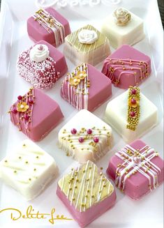 a white plate topped with lots of different types of cakes