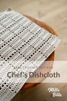 a crocheted dishcloth sitting on top of a wooden table