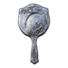 a metal spoon with an ornate design on it