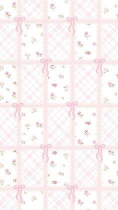 a pink and white checkered wallpaper with roses