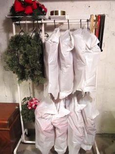 an image of some white bags hanging on a rack