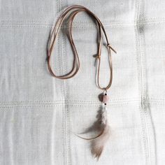 You'll wear this one for life. Beautiful bronze suede adjustable chain. Real agate charm with rooster feather in natural. Black crystal details. Measures 24-34”. Comes in linen travel pouch. Made in USA. Dove Necklace, Rooster Feathers, Feather Jewelry, Travel Pouch, Black Crystals, For Life, Rooster, Made In Usa, Agate