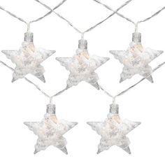 christmas lights hanging from a wire with star shaped decorations on it's ends and one light attached to the string