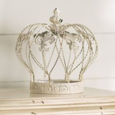 a white crown sitting on top of a table