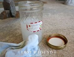 a glass jar sitting on top of a table next to a napkin and a bowl