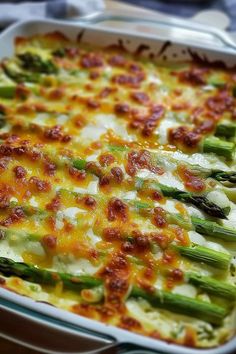 a casserole dish with asparagus and cheese