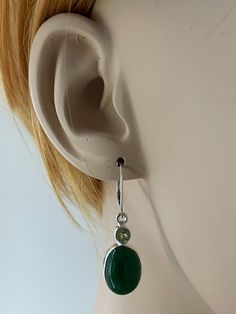 GENUINE NEPHRITE JADE AND PERIDOT EARRINGS Natural and Minimalist Sterling Silver Green Jade and Peridot Dangle Lever-back Earrings Beautifully smooth forest green Nephrite Jade and Peridot are known for having the ability to attract love, luck, and an abundance of wealth!! Metal: .925 Sterling Silver Earrings MEASUREMENT: Natual Peridot Height: 38.1MM (1.5 inches) Width: 10MM (0.4 Inches) Dangles measure approximately 38.1MM (1.5 inches) from the top of the ear wire to the bottom of the ear wir Green Oval Earrings With Natural Stones, Oval Green Earrings With Natural Stones, Green Natural Stones Earrings For Wedding, Green Natural Stone Earrings For Wedding, December Birthstone Jewelry, Book Necklace, Bridal Wedding Earrings, Fire Opal Necklace, Sterling Silver Locket