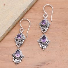 Dewi Putera in Bali creates these lovely amethyst earrings with a touch of vintage flair. The sterling silver dangle earrings feature ornate traditional motifs like bun (curled wires) and jawan (silver granules). Ornate Purple Pierced Earrings, Purple Earrings With Intricate Design As Gift, Ornate Purple Sterling Silver Earrings, Purple Earrings With Intricate Design For Gift, Ornate Purple Dangle Earrings, Ornate Purple Dangle Jewelry, Ornate Purple Drop Earrings, Traditional Purple Dangle Earrings, Purple Dangle Earrings