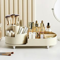 A makeup organizer is the simple solution to your problem and is ideal for streamlining your beauty routine and decluttering your home in one easy step. Not only is this cosmetic organizer practical, but it comes in gorgeous design and size to suit a range of different makeup spaces and needs. This adorable set comes with a larger compartment for storing full-sized bottles and a rotating brush holder to keep your brushes in place. Each compartment can hold a different category. The circular rotating tube makes it easy to organize your makeup brushes, mascara, and eyeliners into different categories. The right side is designed to keep cosmetics, lotions, masks, nail polish, and other small items needed in daily life. It is perfect for the bathroom, living room, bedroom, and countertop on th Makeup Organizer Countertop, Rotating Makeup Organizer, Make Up Storage, Makeup Display, Perfume Organization, Makeup Storage Box, Makeup Holder, Beauty Organization, Cosmetic Display