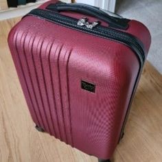 20" 4 Wheel Spinner Carry On Luggage. Body (Without Wheel) Dimensions: 19½ In. H X 13½ In. L X 8½ In. W. Product Weight: 6 Lbs. Made Of Abs: Durable And Lightweight Hard Shell 4 Spinning Wheels For Smooth Mobility And Ease On Wrist For Travelers Fully Lined Interior With Pockets, Compression Straps, And Dividers For Easy Packing And Organizing Top Carry Handle And 4 Side Rubber Studs For Laying On Ground Red Rectangular Luggage For Everyday Use, Rectangular Red Luggage For Everyday Use, Red Rectangular Travel Luggage, Rectangular Red Everyday Luggage, Red Rectangular Luggage For Overnight Trips, Red Luggage With Sleeve For Overnight Trips, Red Luggage With Sleeve For Trip, Red Rectangular Travel Bag With Luggage Sleeve, Red Travel Bag With Luggage Sleeve For Trips