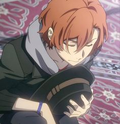 an anime character with red hair and black clothes holding a camera in his right hand