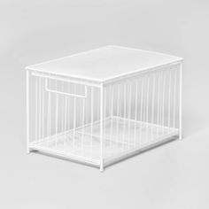 a small white cage on a grey background