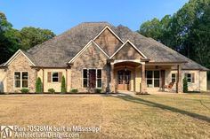 a large brick house with lots of windows