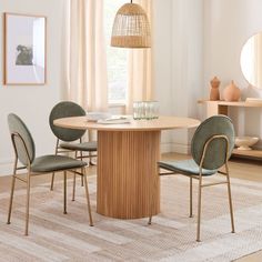 a dining room table with four chairs around it