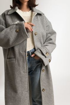 The Cathrine Wool Coat is a relaxed fit, single-breasted carcoat. This woolen, heavy weight style has a soft texture and finish with piping on the inside. It features welt pockets and visible stitching detailing, with button closure and cuff straps. This sustainable coat is tailor made and on demand. It takes us 10 hours to make this coat. PLEASE ALLOW 1-3 BUSINESS DAYS FOR PRODUCTION Boiled Wool Coat, Grey Wool Coat, Visible Stitching, Oxblood Red, Winter Trench Coat, Cool Face, Single Breasted Coat, Car Coat, Boiled Wool