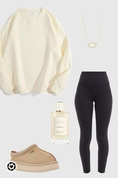 a white sweater, black pants and tan shoes are all part of the outfit set