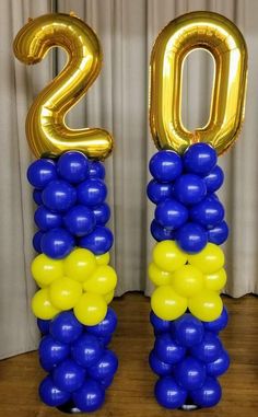 balloons are arranged in the shape of numbers on top of each other, with yellow and blue balloons attached to them