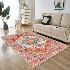 a living room filled with furniture and a large rug