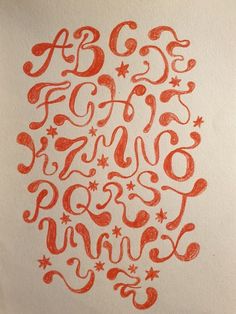 the letters are drawn in red ink on white paper