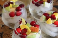 three glasses filled with fruit and ice