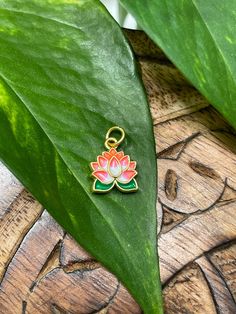 This listing is for (1) PC Lotus Flower Charm Lotus spiritual meaning: ✶ enlightenment ✶ purity ✶ resilience ✶ rebirth  ✶ detachment ✶ spiritual growth ✶ beauty in adversity ✶ strength ✶ divine connection (1) PC Lotus Charm Alloy & Enamel Double Sided Print 0.5" approx Your purchase does not include any additional items (no jewelry making items, no charm casting guides, etc). Additional items pictured are only for scale & inspiration.   Please message me if you have any additional questions! Spiritual Lotus Flower Jewelry For Meditation, Green Spiritual Jewelry For Puja, Lotus Spiritual, Charm Casting, Lotus Flower Pendant, Divine Connections, High Priestess, Divination Tools, Casting Jewelry