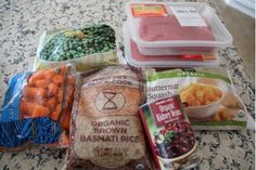 several bags of food sitting on top of a counter