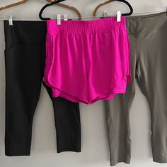 Avia Bundle Of Two Pair Leggings -Euc And One Pair Shorts Nwt All Size Medium Bright Magenta Pink Shorts Have An Elastic Waistband 5” Inseam Nike Shorts Lining Semi Fitted Double Layer Side Pocket On Knee Short Moisture Wicking Toggle Cinch On Both Sides To Adjust Gathering Photos Show With It Loose Or Gathered Tag Calls These Purple But They Are More Pink Than Purple Black Leggings Have Side Slip Pockets High Waisted Approx Measurements Inseam 18” Rise 10.5” Olive Green Leggings Have A Small Zi Pink Stretch Short Pants, Pink Activewear Shorts With Pockets, Pink Activewear With Pockets For Spring, High Waist Pink Activewear With Pockets, Spring Pink Activewear With Pockets, Pink Short Activewear With Pockets, Casual Pink Pants With Built-in Shorts, Pink Summer Activewear Long Pants, Pink Stretch Shorts With Pockets