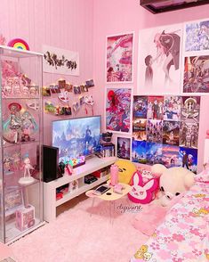 a bedroom with pink walls and lots of toys on the shelves in front of the tv