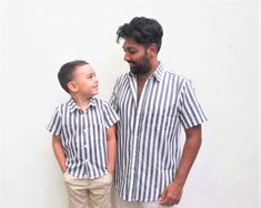 Now Dad can match his little one in this amazing Father and son matching Button up Shirt set! Please note: Shirts need to be added to basket separately to receive the set. This bright and super trendy button up shirt suits any modern hipster. The short sleeved shirt comes in a trendy bright Fabric. Made from 100% cotton fabric. **Made to order (Processing time: approx. 5-10 working days Child Size: 3m - 8 years Adult Size: S, M, L, XL, XXL S Collar:14.5 Shoulder:16.5 Chest:40 Waist:38 Hips:40 Le Father And Son Clothing, Dad And Son Shirts, Father Son Matching Shirts, Father Son Shirts, Modern Hipster, Grey Striped Shirt, Bright Fabric, Suspenders For Boys, Dad And Son