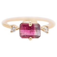 This ring features a beautiful pink and white bi-color tourmaline in a classic NNJ Designs ring setting with sparkling natural earth mined diamonds set in solid 14k gold. A gorgeous modern look that's perfectly balanced between minimalist and glamour. This ring also makes a lovely October birthstone gift for your loved ones! Specifications Item Type: Ring Centre Stone: Tourmaline Treatment: Heated Weight: 1ct Head size: 7x5mm Shape: Emerald cut Hardness: 7-7.5 Metal: 14k/1.74g Diamond Clarity/Co Birthstone Gifts, Ring Setting, Tourmaline Ring, Natural Earth, October Birth Stone, Diamond Clarity, 1 Carat, Emerald Cut, Pink And White