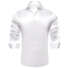 The White Silk Dress Shirt is a must-have for any stylish wardrobe. Made from premium quality silk, it feels luxurious against the skin and drapes beautifully, providing a sleek and sophisticated look. The classic white color of this shirt makes it versatile and easy to pair with any suit or tie, making it perfect for any formal or professional occasion. It has a button-up front and a traditional point collar, lending a timeless feel to the design. The material is breathable and lightweight, and it's easy to care for, making it an excellent option for both travel and everyday wear. Add this white silk dress shirt to your collection today and elevate your style with a timeless piece. Handmade 100% Silk Dry Clean Only We offer: | FREE RETURNS| 1-YEAR WARRANTY| 30-DAY MONEY-BACK GUARANTEE| 10 White Slim Fit Shirt For Party, Elegant Silk Top For Business, White Long Sleeve Luxury Dress Shirt, Luxury White Long Sleeve Dress Shirt, Elegant Wrinkle-resistant Button-up Shirt, Classic Fitted Dress Shirt For Party, Elegant Silk Shirt For Business Casual, Elegant Semi-formal Summer Shirt, Elegant Business Top With Wrinkle-resistant Fabric