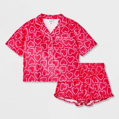 Your kid will hit the hay in cute style with this 2-Piece Short-Sleeve Coat Pajama Set from art class™. This set includes a sleep shirt and shorts, both crafted from recycled polyester knitted fabric for comfortable wear. The short-sleeve button-down shirt features a classic notched collar with a chest patch pocket, while the ruffled hem shorts have a full elastic waistband for a snug fit. Mix and match the set with other PJ separates for a variety of looks. art class™: One-of-a-kind looks for t Short Sleeve Coat, Button Up Pajamas, Flannel Pants, Satin Short, Shirt And Shorts, Print Coat, Fabric Tape, Kids Outfits Girls, Sleep Shirt