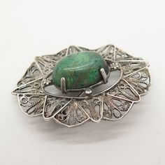 925 Sterling Silver Vintage Turquoise Gem Filigree Pin Brooch / Pendant Weight: 9.5g WELCOME TO PAWN SHOP We are an actual pawn shop and have been in business for over 25 years. Since 1990, our establishment has been serving a variety of clients by providing them with short term cash solutions and options of liquidity regarding their treasured heirlooms. Acknowledging that today′s customers are very sophisticated and are looking for a variety of investments, our acquisitions are hand-picked for Green Gemstone Pendant Brooches, Vintage Silver Brooch With Gemstone, Vintage Silver Gemstone Brooch, Antique Green Pendant Brooch, Antique Green Gemstone Brooches, Sterling Silver Green Brooch, Green Sterling Silver Brooch, Green Sterling Silver Brooch Jewelry, Oval Green Brooch Jewelry