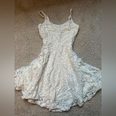 Creamy White Lace Dress From American Eagle. Never Worn And In Perfect Condition. The Dress Is Fully Lined And Has Adjustable Straps. Off White Lace Mini Dress, Casual Cream Lace Mini Dress, Casual White Lace Dress With Lace Trim, Casual White Mini Length Lace Dress, Casual White Mini Lace Dress, Casual Off White Lace Mini Dress, White Lace Mini Dress For Day Out, Casual Off-white Lace Mini Dress, Casual White Lace Brunch Dress