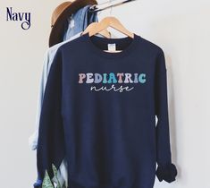 Display your nursing profession in style with this beautiful and trendy retro Peds Nurse Sweatshirt.  With a relaxed Unisex fit, this Cute Pediatric Nurse Shirt provides all day comfort and is sure to get compliments from your co-workers. This crewneck also makes a thoughtful Peds Nurse Gift for a future Pediatric Nurse or for Nurse Appreciation Week. ⭐ SIZING These popular sweatshirts are UNISEX size suitable for both men and women and have a relaxed fit. If you prefer a more fitted look, size Fall Crew Neck Nursing Top, Cotton Nursing-friendly Relaxed Fit Sweatshirt, Casual Cotton Sweatshirt For Nursing, Cotton Relaxed Fit Nursing Sweatshirt, Nursing Cotton Sweatshirt With Crew Neck, Cotton Sweatshirt For Nursing In Fall, Cotton Nursing Sweatshirt For Fall, Popular Sweatshirts, Peds Nurse