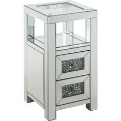 a mirrored side table with three drawers on one end and an open drawer on the other