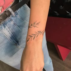 a woman with a tattoo on her arm