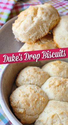 some biscuits are sitting in a bowl on a checkered table cloth with the words duke's drop biscuits