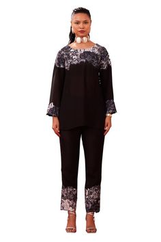 Black tunic with contrast floral applique yoke. Paired with a straight pant with floral applique hem. - Aza Fashions Elegant Black Pants Set, Elegant Black Long Pants Set, Black Spring Sets With Straight Pants, Black Straight Pants Set For Spring, Black Floral Embroidered Sets For Spring, Spring Black Sets With Floral Embroidery, Elegant Fitted Sets With Embroidered Hem, Elegant Long Sleeve Sets With Embroidered Hem, Tunic With Pants