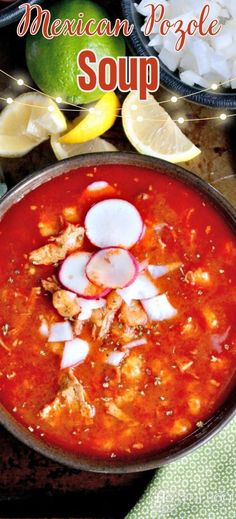 mexican style soup in a bowl with limes and onions