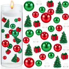 a candle with christmas decorations on it next to a glass container filled with balls and ornaments