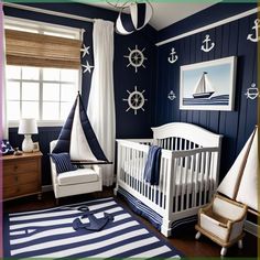 a baby's room decorated in blue and white with an anchor, ship, and sailboat theme