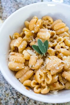 a white bowl filled with macaroni and cheese