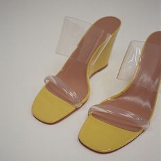 Introducing our stylish 'Yellow Open Toe transparent Heels Mules Wedge Jelly Sandals.' These vibrant sandals feature a comfortable wedge heel and transparent straps for a trendy and playful look. Color: Yellow Heel Type: Wedge heel Heel height: 4" / 100 mm approx Product measurements were taken using size 8. Please note that measurements may vary by size. Toe: Open toe Handcrafted US sizing. Fits true to size. Clear Heel Boots, Clogs Platform, Heels Wedge, Cowboy Shoes, Transparent Heels, Metallic Boots, Mule Heels, Shoes Heels Classy, Yellow Heels