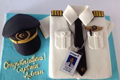 a cake that is shaped like a captain's uniform