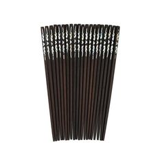 black and silver metal straws are lined up on a white surface, with the top half