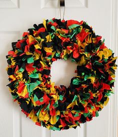 a colorful wreath hanging on the front door