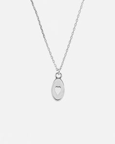 A dainty Heart necklace is suspended from a sleek extra fine chain, freely moving on the chain with a beautiful fluidity. Handcrafted in solid 925 sterling silver. This dainty heart necklace is ideal for everyday wear. Perfect to wear alone, or layer with other necklaces from our collection. ___________________________________ D E T A I L S :▪ Pendant Size - 8x10 mm▪ Solid 925 Sterling Silver Necklace▪ Hypoallergenic▪ Shipped from Berlin▪ Orders to the US - No Customs Fees Upon the Delivery_____ Simple Silver Heart Necklace With Delicate Chain, Minimalist Silver Heart Necklace With Delicate Chain, Minimalist Sterling Silver Heart Necklace, Minimalist White Gold Heart Necklace For Everyday, Sterling Silver Open Heart Charm Necklace With Delicate Chain, Minimalist Sterling Silver Heart Charm Necklace, Sterling Silver Minimalist Heart Necklace For Anniversary, Delicate Silver Heart Necklace For Everyday, Minimalist White Gold Open Heart Necklace