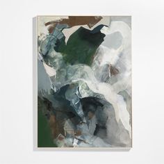 an abstract painting with white, green and brown colors in a frame on the wall